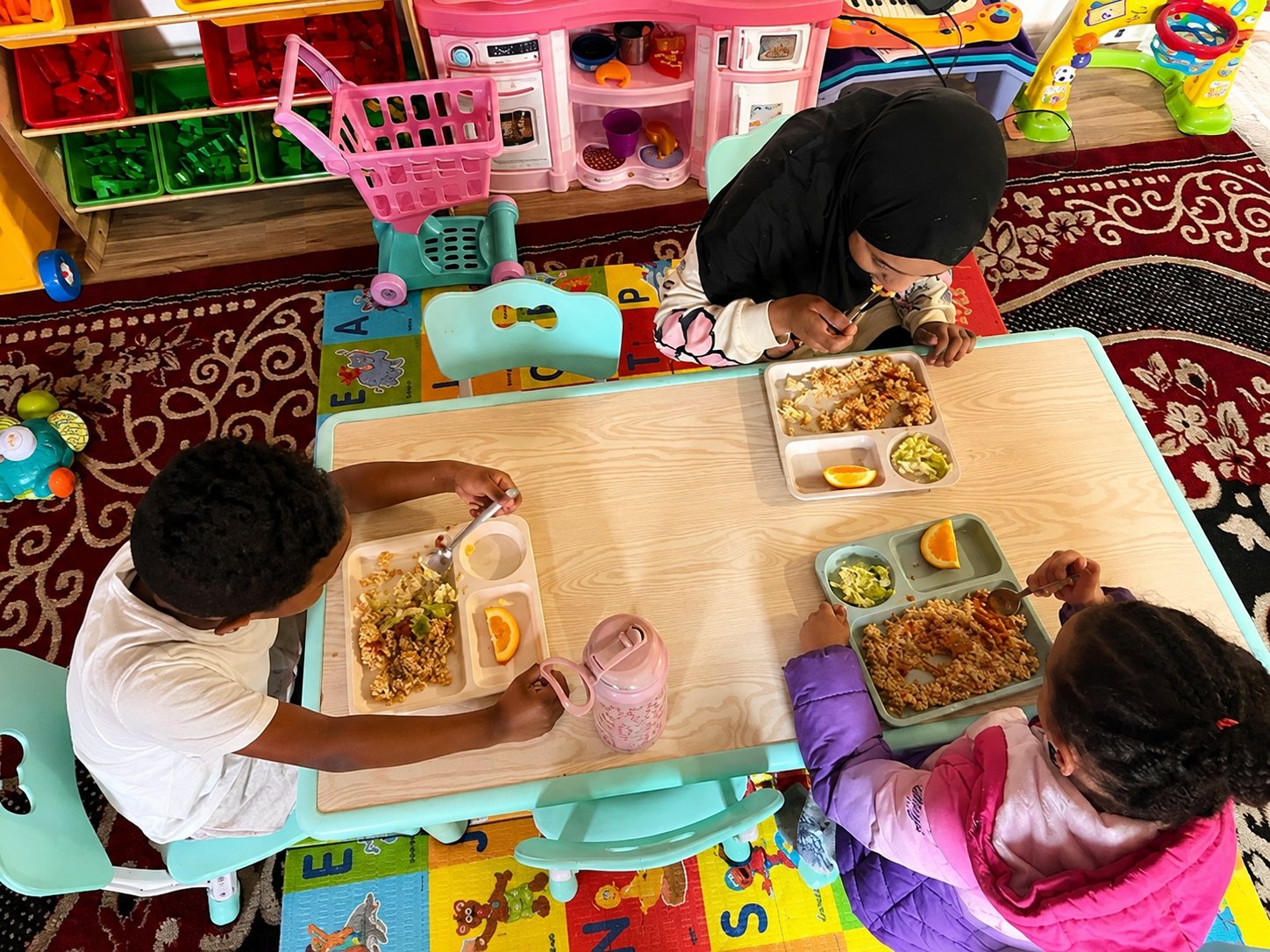 Children enjoying a meal at Suad Home Daycare, licensed home daycare in Seattle WA